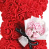 Heart-shaped bouquet of red roses with a small pink rose bouquet attached