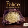 Large bouquet of cream roses wrapped in purple paper