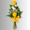 Yellow and white roses in a clear glass vase with a yellow ribbon
