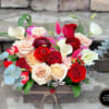 Rectangular wooden box filled with red and blush roses, white calla lilies, and mixed accent blooms