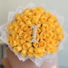 Bouquet of yellow roses with a white letter I centerpiece