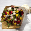 A vibrant mix of red, yellow, white and blush-pink roses creates an