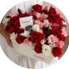 A lush heart-shaped arrangement of densely packed red roses opens like a