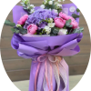 A lavender hydrangea crowned with blushing pink peonies makes a soft, romantic