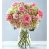 Pink rose bouquet in a clear glass vase