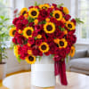 Large bouquet of red roses and yellow sunflowers in a white vase