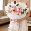 A graceful and elegant bouquet featuring 24 beautiful pink and white roses
