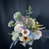 Mixed pastel bouquet with daisies, roses, and airy filler flowers