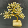 Decorative crystal tree sculpture on a stone base