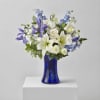 A stunning blend of blue and white blooms artfully arranged to create