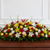 Large casket spray with red, yellow, and white flowers