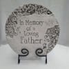 Decorative memorial plaque reading "In Memory of a Loving Father" on a stand