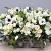 In this beautiful arrangement we have anemones as the focus of this