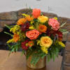 Mixed bouquet of roses and chrysanthemums in a gold vase