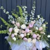 A dreamy garden-style arrangement that reads like a page from a storybook-soft