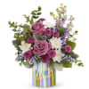 This stunning bouquet features elegant lavender roses, paired with vibrant purple button