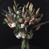 This tall arrangements is composed of white hydrangeas, roses and lilies.



We will