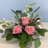 A low-profile arrangement featuring roses.