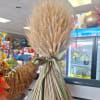 Bundle of dried wheat tied with a satin ribbon
