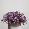 A beautifully handcrafted floral arrangement featuring delicate lilac blooms, thoughtfully designed to