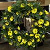 Yellow daisy wreath on a standing easel