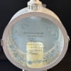 Round memorial lantern with a candle and floral quote insert