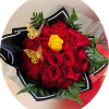 A dense cloud of red roses punctuated by a single bright yellow