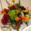 Colorful mixed flower arrangement in a glass vase