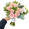 A timeless classic bridal bouquet featuring soft pink roses and fresh seasonal