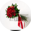 A dense cluster of velvety red roses creates an instantly romantic centerpiece