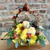 This basket is filled with fall mums, mini carnations, roses, filler, grasses