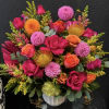 Shown in Premium Size
Hot pink and orange roses take center stage in