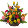 Colorful flower arrangement in a wicker basket with roses and daisies
