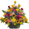 Mixed bouquet of roses, sunflowers, and carnations in a black basket
