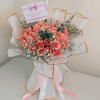 Bouquet of pink roses with baby's breath and ribbon wrapping