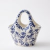 Blue and white ceramic basket-shaped vase with floral pattern