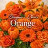 Orange floral arrangement with roses, lilies, tulips, and daisies