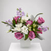Pink and white mixed bouquet in a white vase