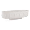 White oval ceramic planter with embossed face motifs