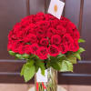 Large bouquet of red roses in a glass vase