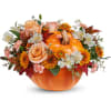 Pumpkin-shaped vase with peach roses and orange and white flowers