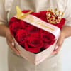 Heart-shaped box of red roses with a "My Princess" ribbon and gold crown toppers