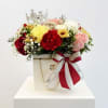 Mixed bouquet of roses and carnations in a decorated gift box