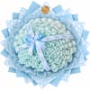 Bouquet of pale blue roses wrapped in patterned blue paper with a ribbon