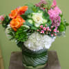 This abundance of Orange Roses, Kale flowers, Pink Hyacinth, White Hydrangeas, Bavaria