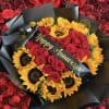 Bouquet of red roses and yellow sunflowers wrapped in black paper