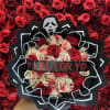 Bouquet of red and cream roses with a skull decoration