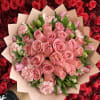 Pink rose bouquet with carnations and tulips wrapped in blush paper