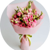 A dramatic cluster of deep red roses rises from a sleek black