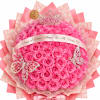Pink rose bouquet with a tiara, butterfly decorations, and a ribbon band